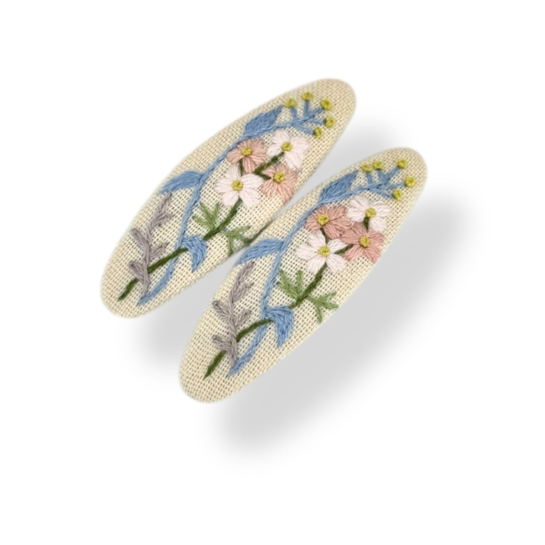 Blush beige hand embroidered hair clips with pastel floral design, perfect cute hair accessories for women and flower girl gift ideas.