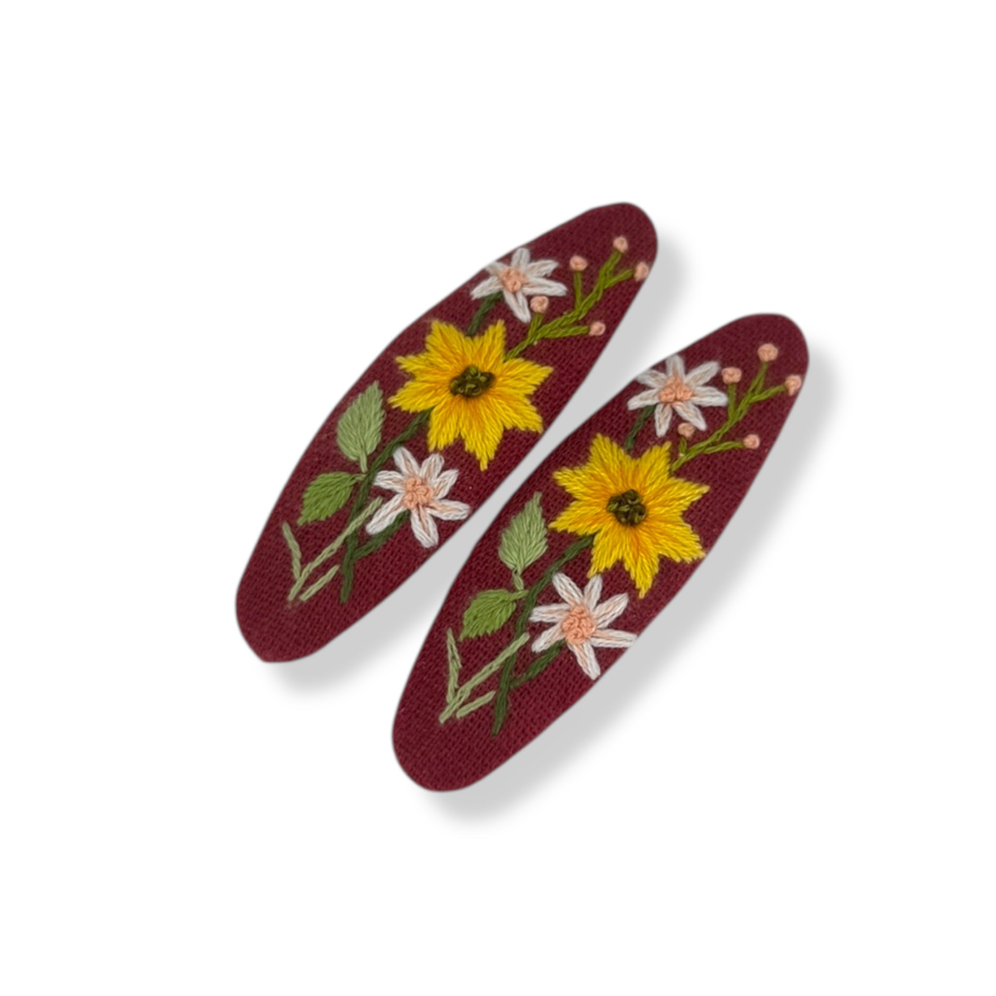 Crimson Daisy Hand Embroidery Hair Clips featuring yellow and white floral designs on maroon fabric, perfect cute hair accessories for women and girls.