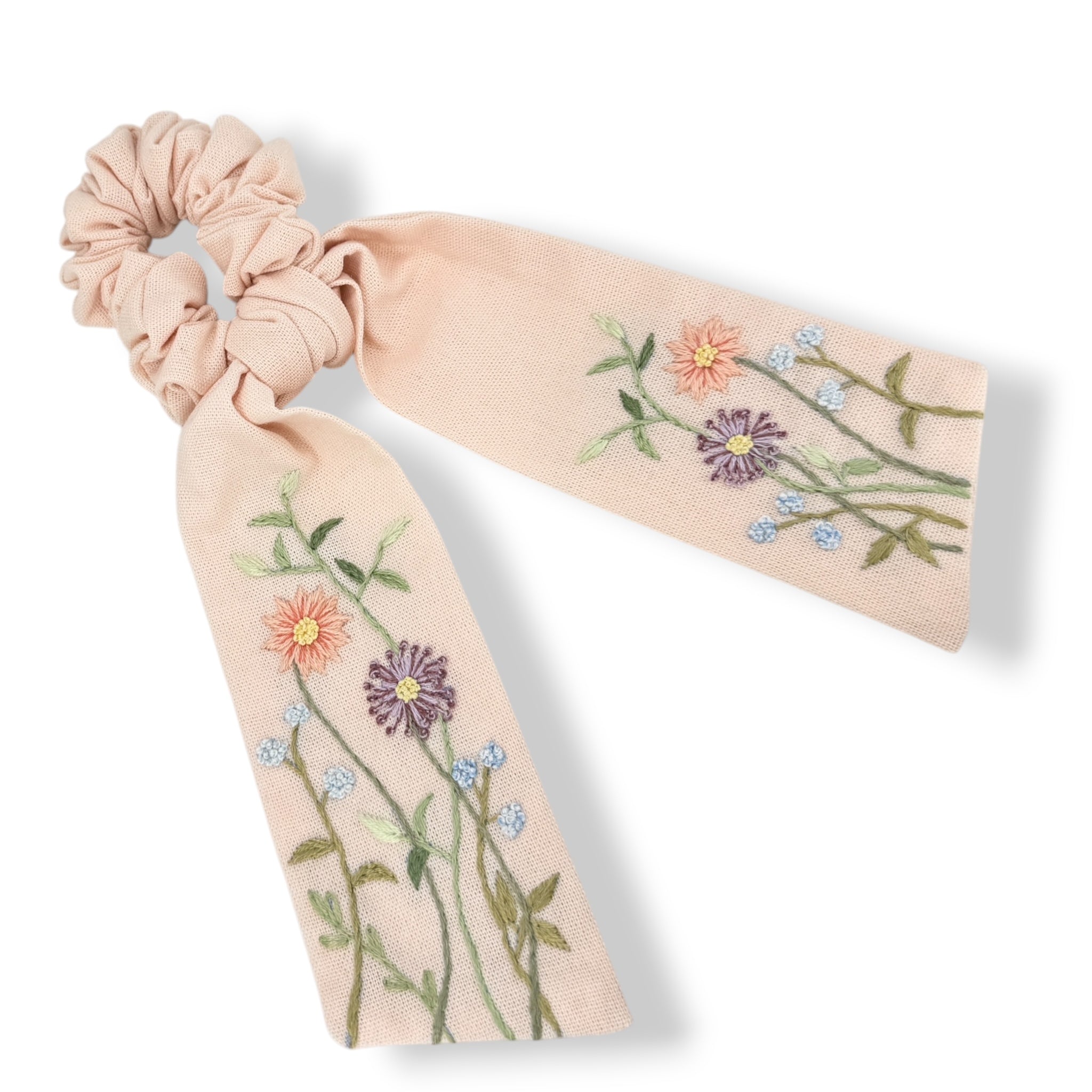 Floral hand embroidered scrunchie with pastel flowers on peach linen, perfect flower girl proposal gift or stylish hair clip for her.