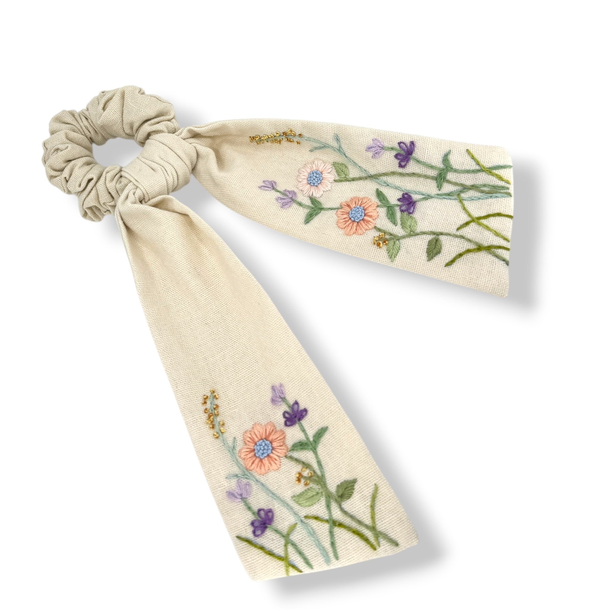 Floral hand embroidery scrunchie with long cream fabric tails, perfect gift for her and stylish hair accessory for women and teens.