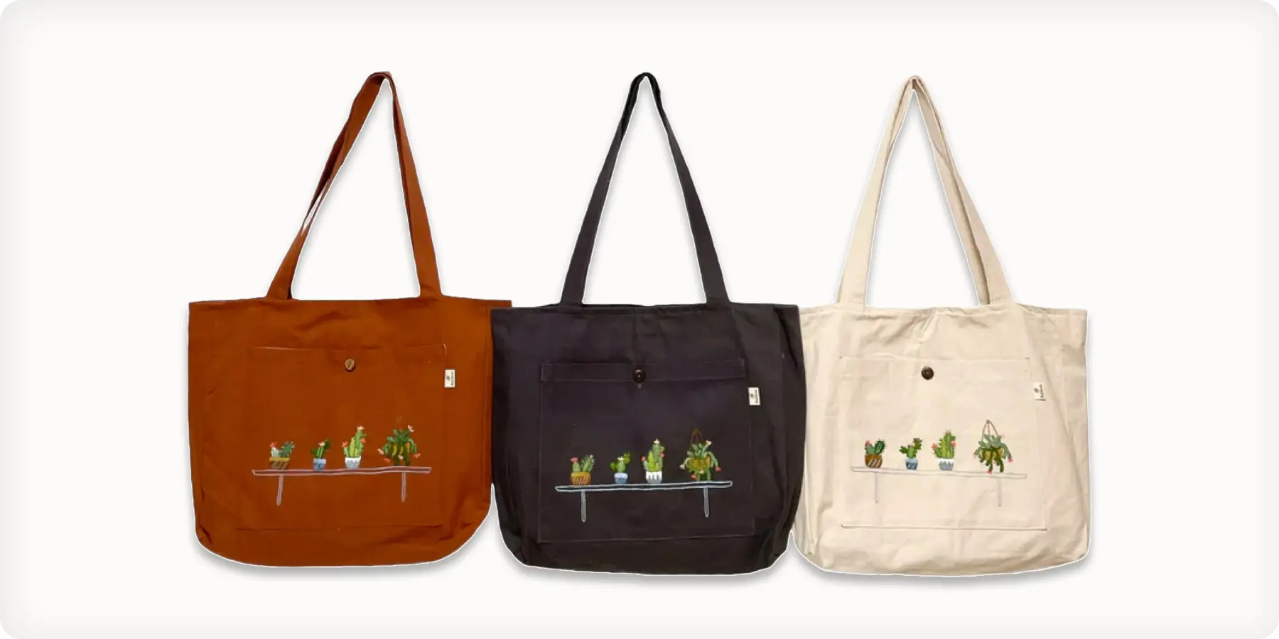 Three tote bags featuring various plant designs, showcasing a blend of nature and fashion in a stylish arrangement.